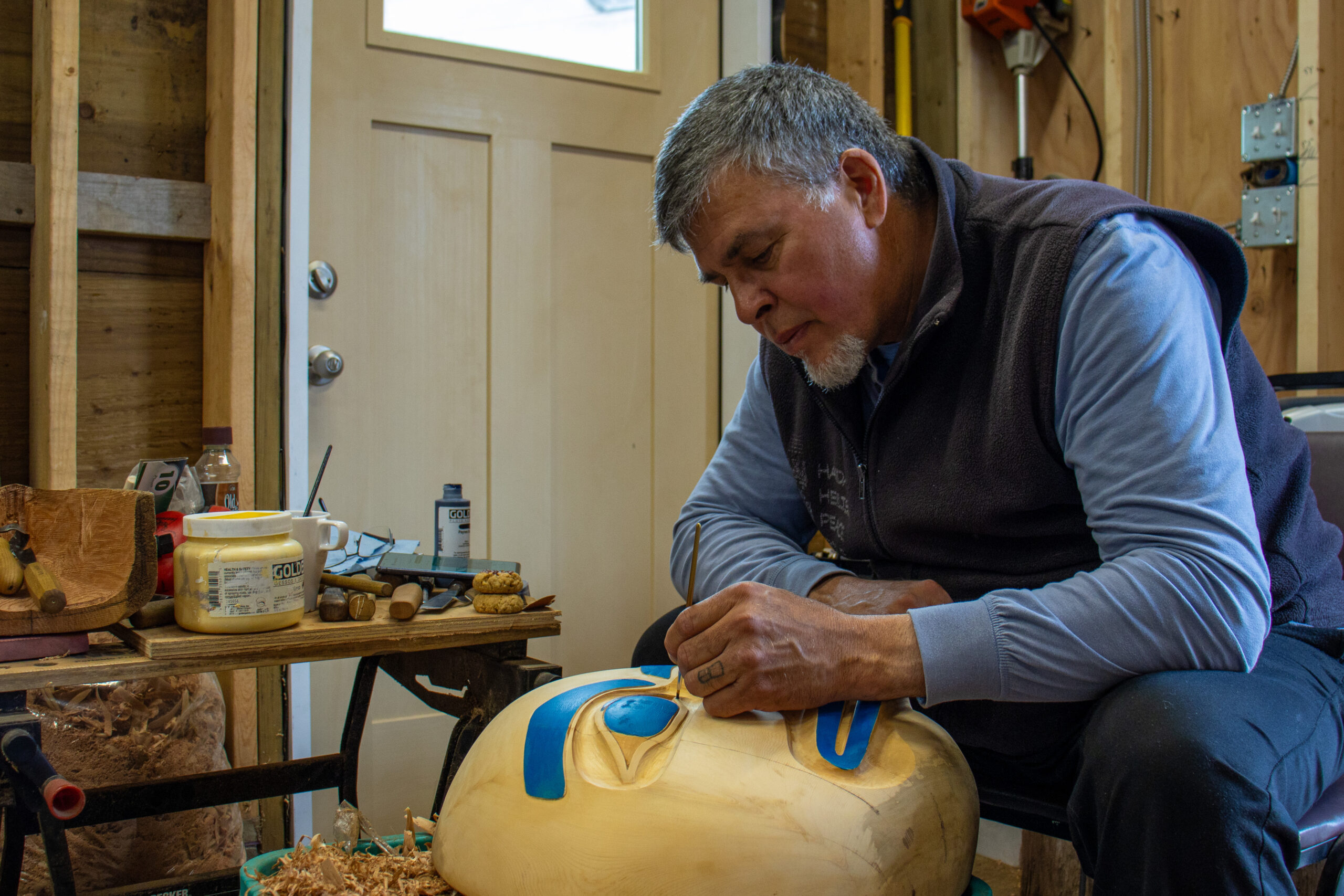 Kihlyaahda Christian White, a renowned Haida artist and carver from Old Massett, Haida Gwaii