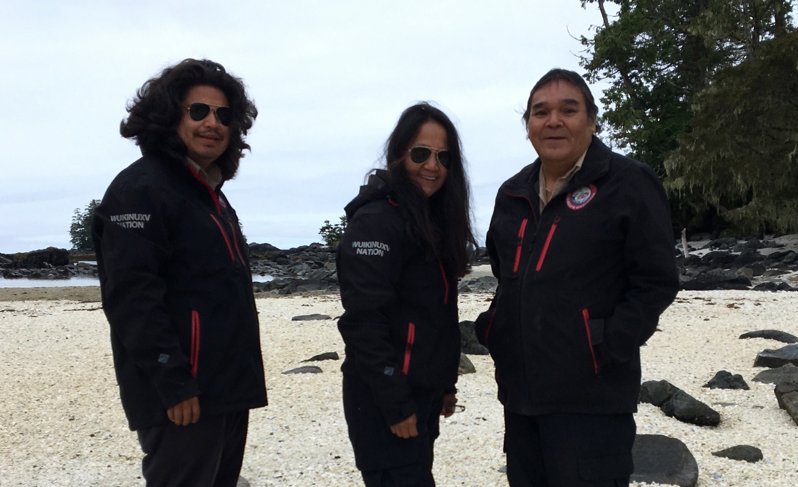 Wuikinuxv Guardians take a break for a picture during Raven Rescue training, summer 2018. From left to right: Alec Willie, Lena Collins and Patrick Johnson. (Image: Dana Holtby)