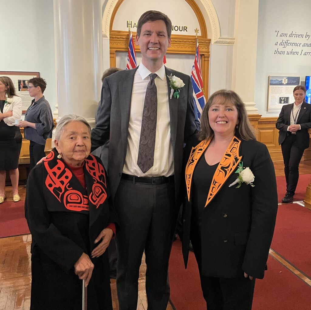 North Coast-Haida Gwaii MLA Laanas Tamara Davidson (right) stands with Premier David Eby and her mother, Siid Quns (Lois Rullin).